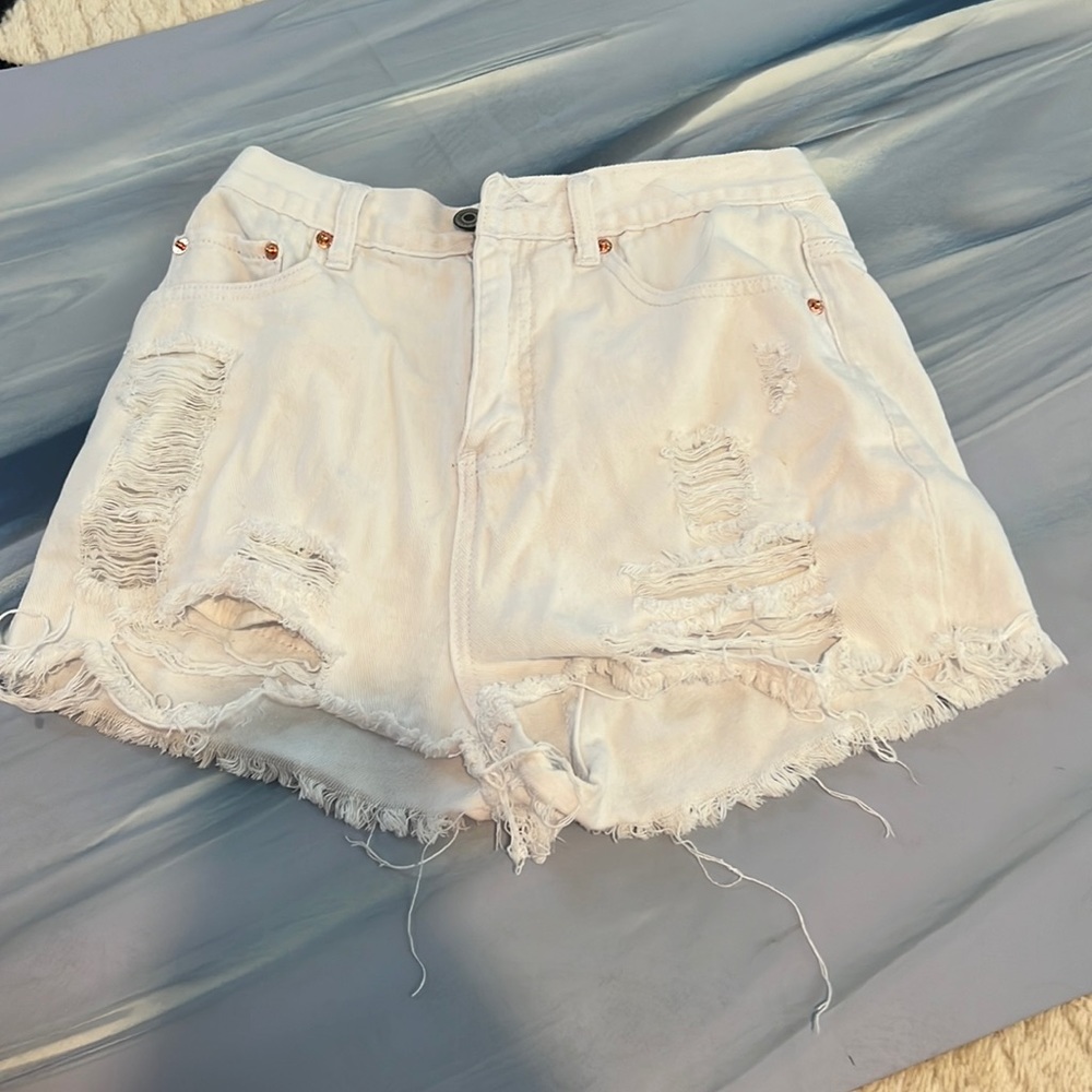 White denim distressed shorts